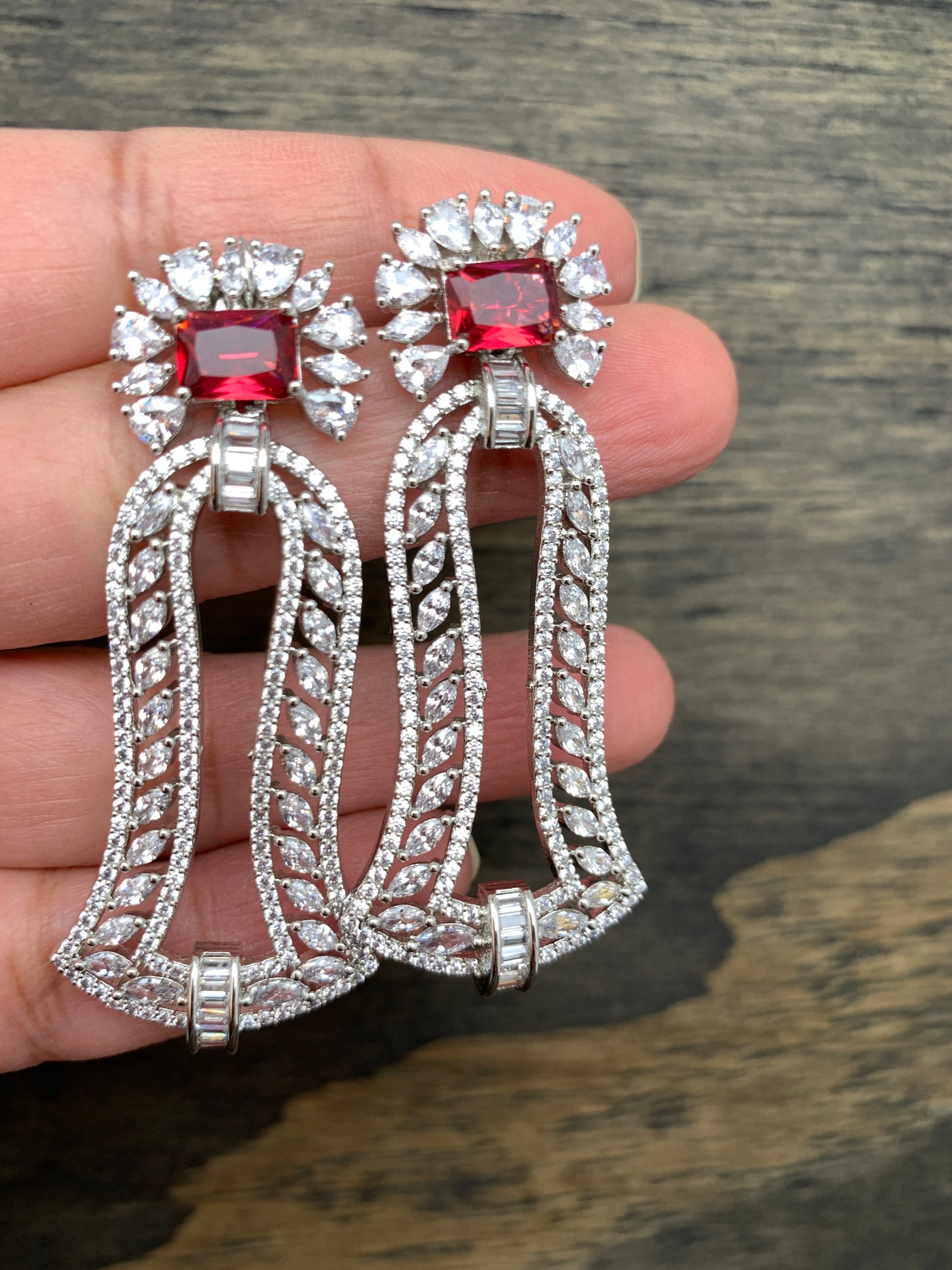 AD Wine Red Stone Bell Pattern Earrings in Silver Polish