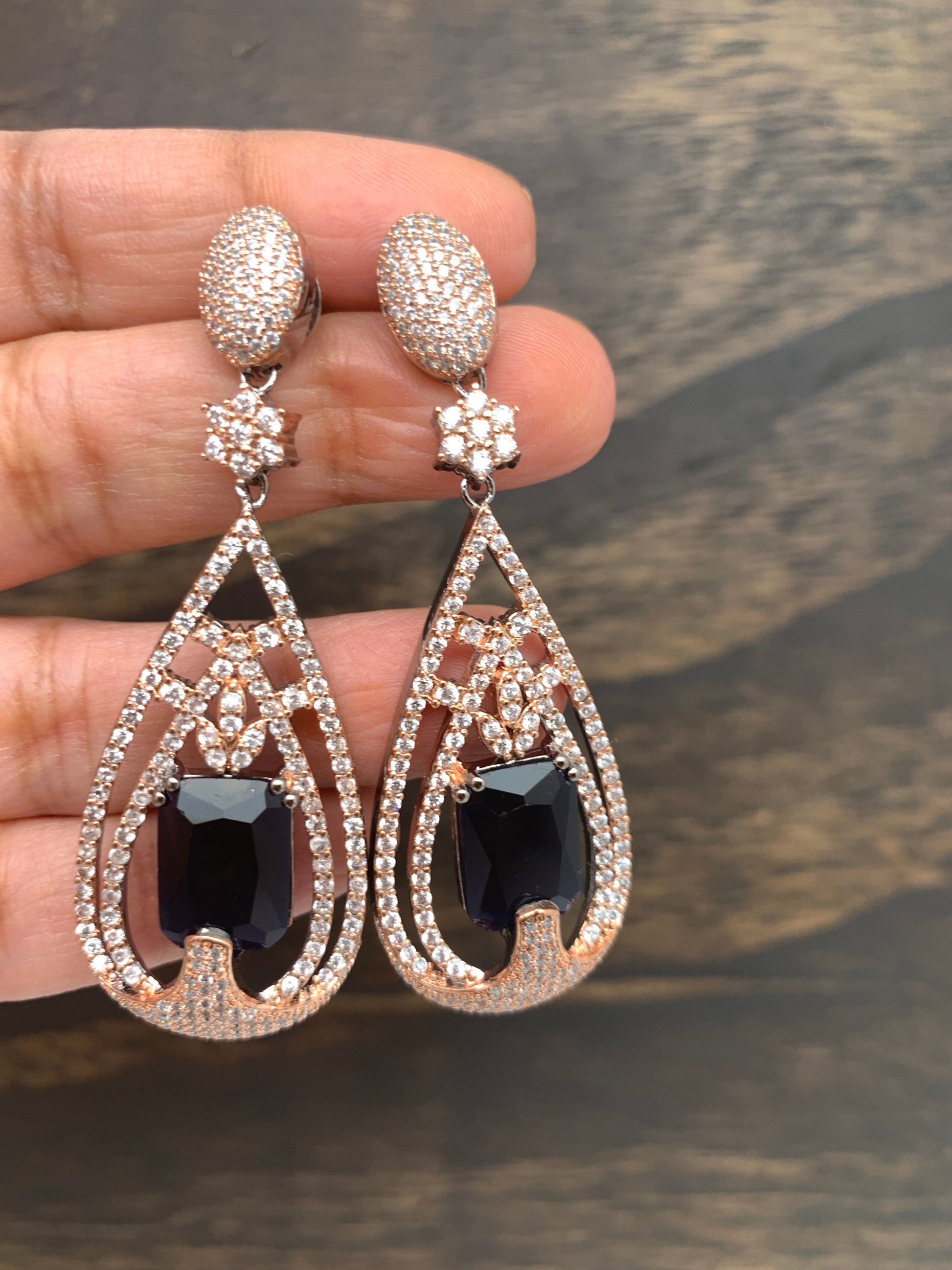 AD Earrings with Blue Stone in Rose Gold Polish