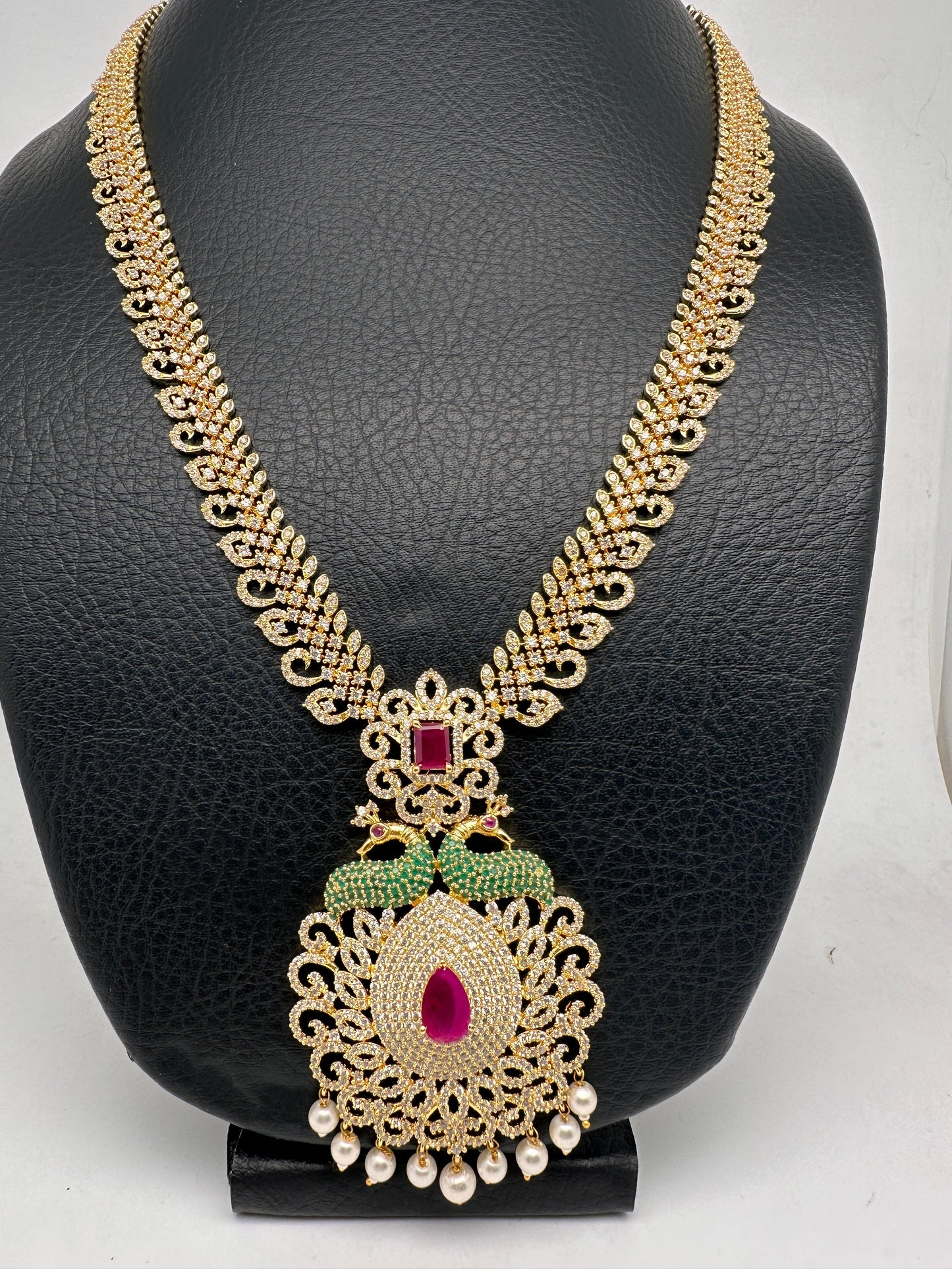 AD Red Stone Peacock Pendent Golden Finish Long Necklace